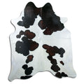Tricolour cowhide rug of about 220 × 190 cm, seen from above: the exact hide you receive