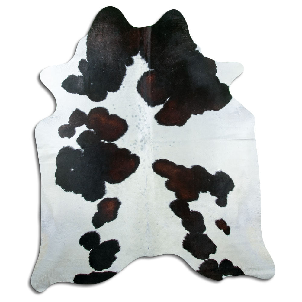 Tricolour cowhide rug of about 220 × 190 cm, seen from above: the exact hide you receive