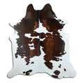 Tricolour cowhide rug of about 200 × 190 cm, seen from above: the exact hide you receive