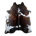 Tricolour cowhide rug of about 240 × 200 cm, seen from above: the exact hide you receive