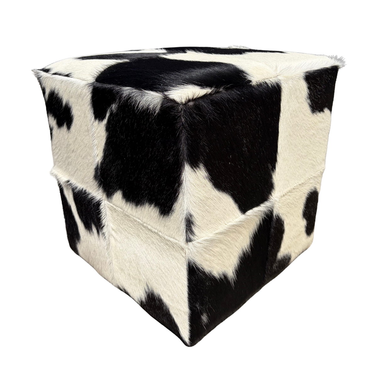 Patchwork cowhide ottoman in black and white
