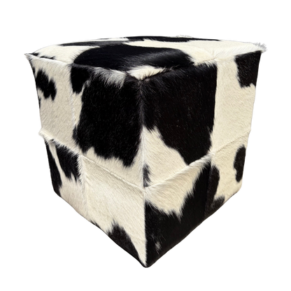 Patchwork cowhide ottoman in black and white