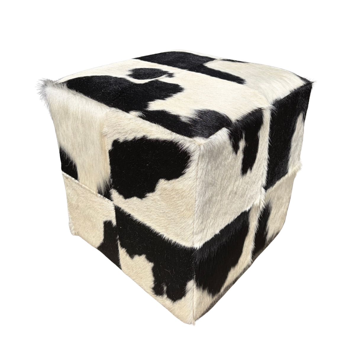 Patchwork cowhide ottoman in black and white, another piece