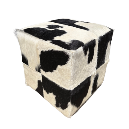 Patchwork cowhide ottoman in black and white, another piece