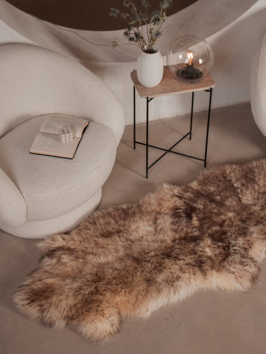 Mouflon sheepskin runner of about 180 × 60 cm on the floor in a living room
