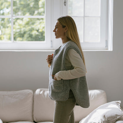 The grey Island merino vest from the side