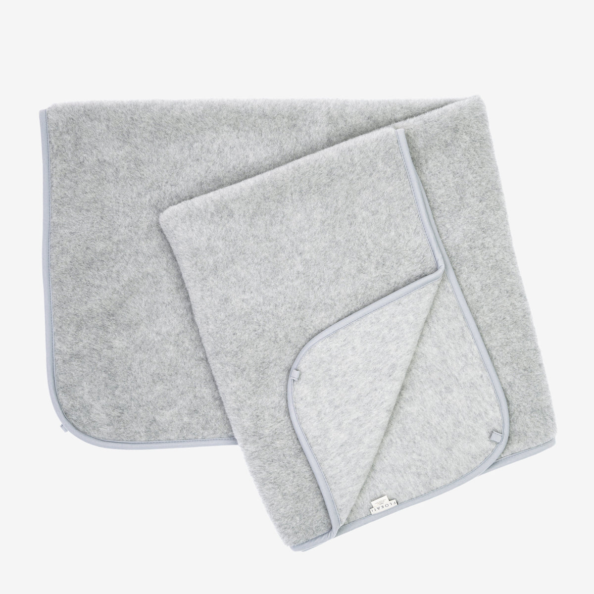 Meringue 1-ply merino blanket folded open