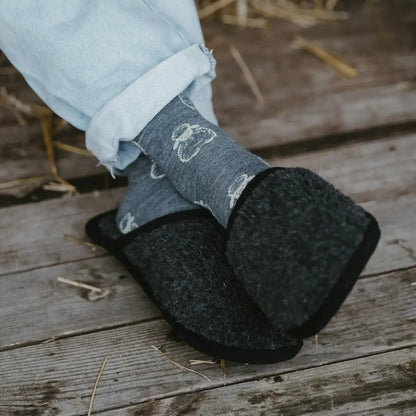 Granite merino slippers worn on a wooden deck