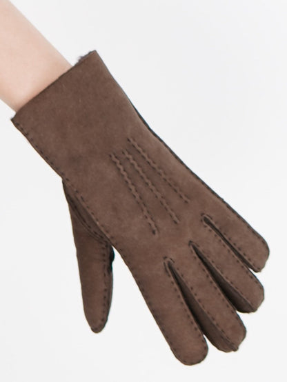 Brown sheepskin glove worn on the hand