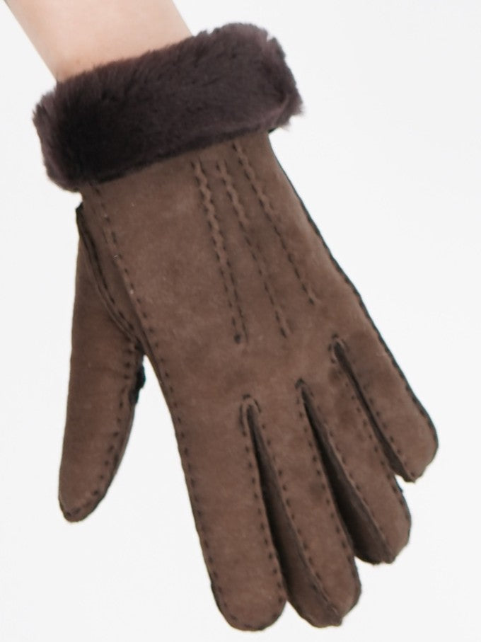 Brown sheepskin glove with its folded sheepskin cuff