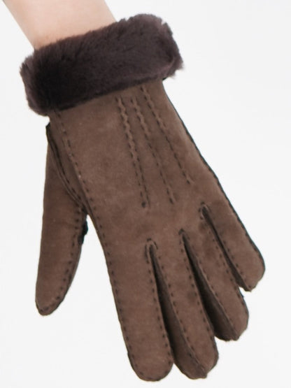 Brown sheepskin glove with its folded sheepskin cuff