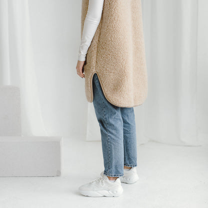 The long beige Pearl merino vest, side view
