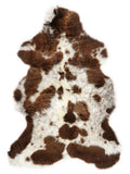British multicolour sheepskin rug of about 110 × 65 cm, seen from above: the exact sheepskin you receive