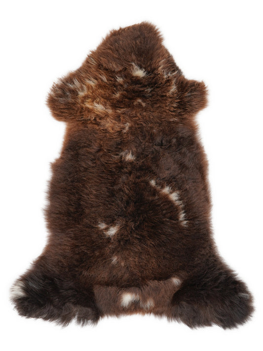 British multicolour sheepskin rug of about 110 × 50 cm, seen from above: the exact sheepskin you receive