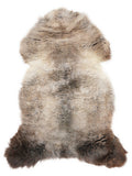 British multicolour sheepskin rug of about 120 × 65 cm, seen from above: the exact sheepskin you receive