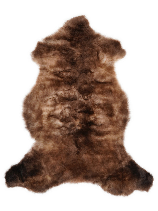 British multicolour sheepskin rug of about 110 × 60 cm, seen from above: the exact sheepskin you receive