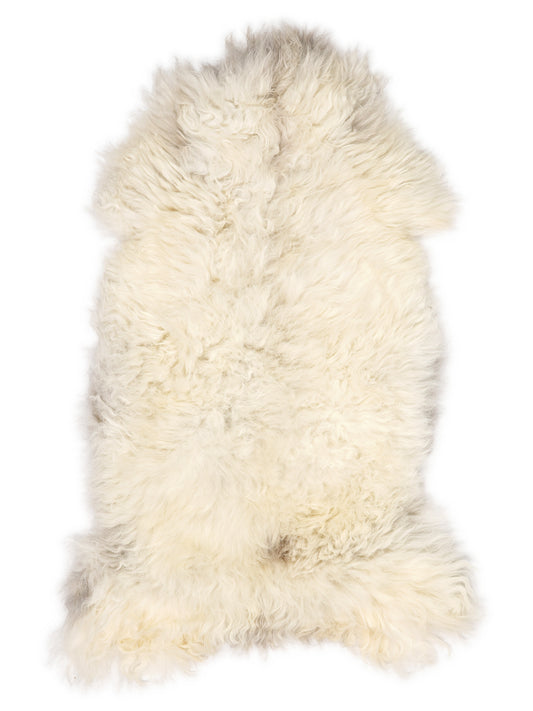 British multicolour sheepskin rug of about 130 × 70 cm, seen from above: the exact sheepskin you receive