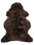 Brown sheepskin rug of about 110 × 65 cm, seen from above: the exact sheepskin you receive