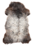 British multicolour sheepskin rug of about 120 × 65 cm, seen from above: the exact sheepskin you receive