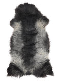 British multicolour sheepskin rug of about 120 × 60 cm, seen from above: the exact sheepskin you receive