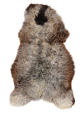 British multicolour sheepskin rug of about 130 × 75 cm, seen from above: the exact sheepskin you receive