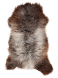 British multicolour sheepskin rug of about 120 × 65 cm, seen from above: the exact sheepskin you receive
