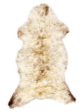 British multicolour sheepskin rug of about 115 × 55 cm, seen from above: the exact sheepskin you receive