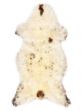 British multicolour sheepskin rug of about 130 × 60 cm, seen from above: the exact sheepskin you receive