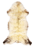 British multicolour sheepskin rug of about 120 × 55 cm, seen from above: the exact sheepskin you receive