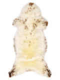 British multicolour sheepskin rug of about 130 × 55 cm, seen from above: the exact sheepskin you receive