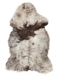 British multicolour sheepskin rug of about 135 × 70 cm, seen from above: the exact sheepskin you receive