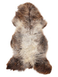 British multicolour sheepskin rug of about 135 × 65 cm, seen from above: the exact sheepskin you receive