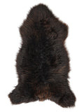 Brown sheepskin rug of about 135 × 65 cm, seen from above: the exact sheepskin you receive
