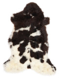 British multicolour sheepskin rug of about 110 × 55 cm, seen from above: the exact sheepskin you receive