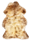 British multicolour sheepskin rug of about 105 × 65 cm, seen from above: the exact sheepskin you receive
