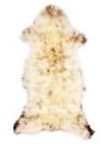 British multicolour sheepskin rug of about 120 × 50 cm, seen from above: the exact sheepskin you receive