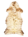 British multicolour sheepskin rug of about 115 × 55 cm, seen from above: the exact sheepskin you receive