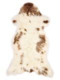 British multicolour sheepskin rug of about 130 × 60 cm, seen from above: the exact sheepskin you receive