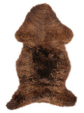 Brown sheepskin rug of about 105 × 50 cm, seen from above: the exact sheepskin you receive