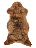 Brown sheepskin rug of about 125 × 60 cm, seen from above: the exact sheepskin you receive