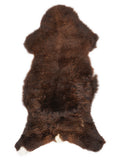 Brown sheepskin rug of about 110 × 55 cm, seen from above: the exact sheepskin you receive