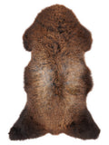 Brown sheepskin rug of about 110 × 55 cm, seen from above: the exact sheepskin you receive