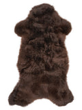 Brown sheepskin rug of about 100 × 50 cm, seen from above: the exact sheepskin you receive