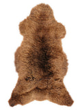Brown sheepskin rug of about 120 × 60 cm, seen from above: the exact sheepskin you receive