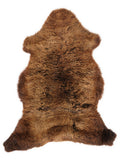 Brown sheepskin rug of about 105 × 60 cm, seen from above: the exact sheepskin you receive