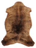 Brown sheepskin rug of about 105 × 60 cm, seen from above: the exact sheepskin you receive