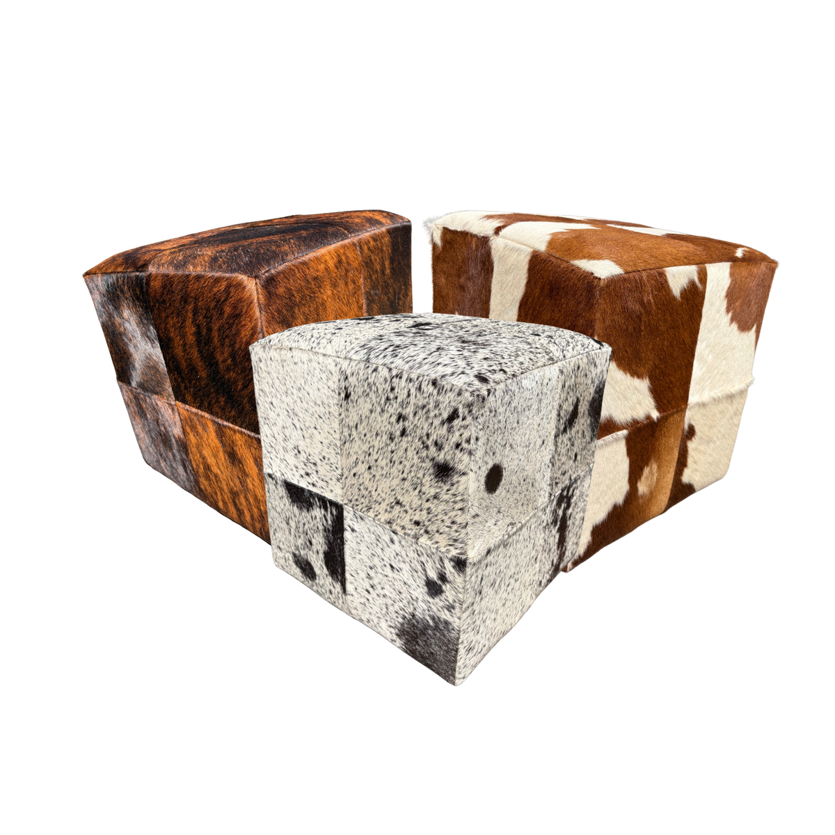 Several patchwork cowhide ottomans together