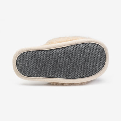 Dotted sole of a beige merino slipper