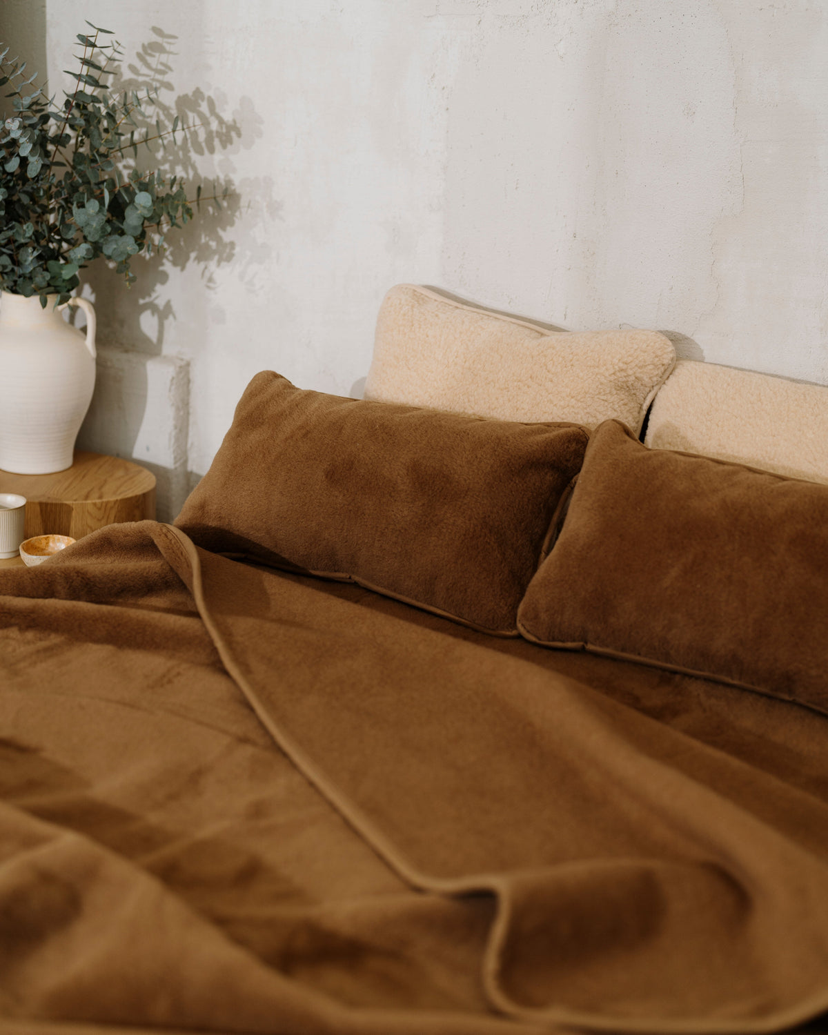 Chocolate wool blanket on a bed