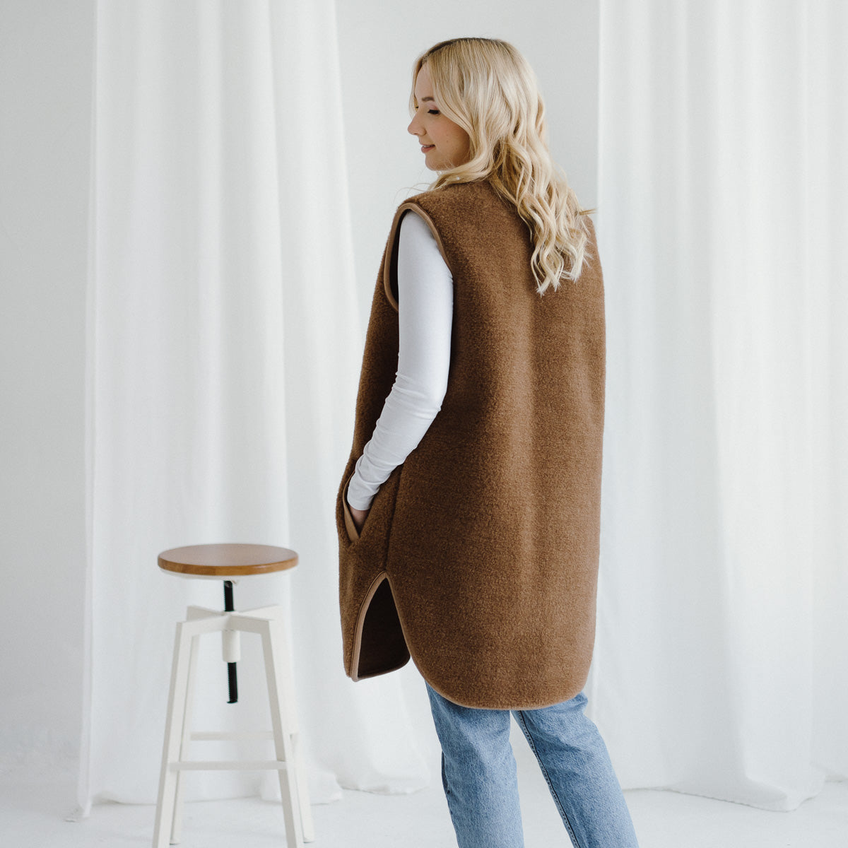 Side view of the Pearl vest worn with jeans